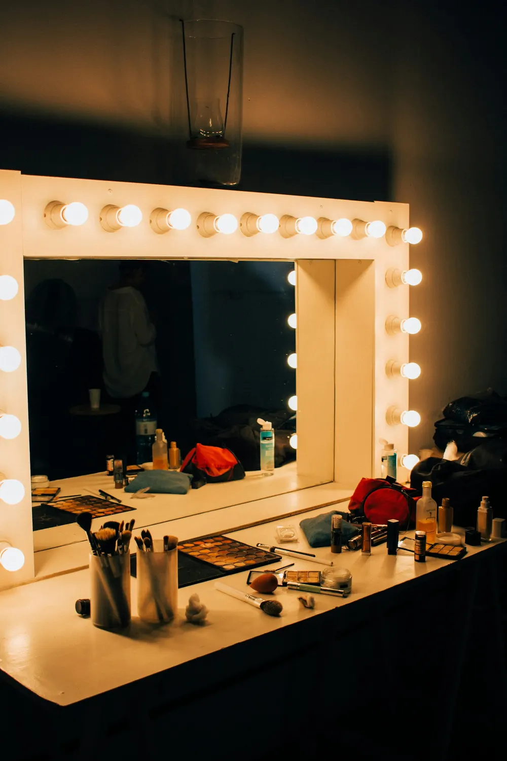 A softly lit mirror and station, after hours