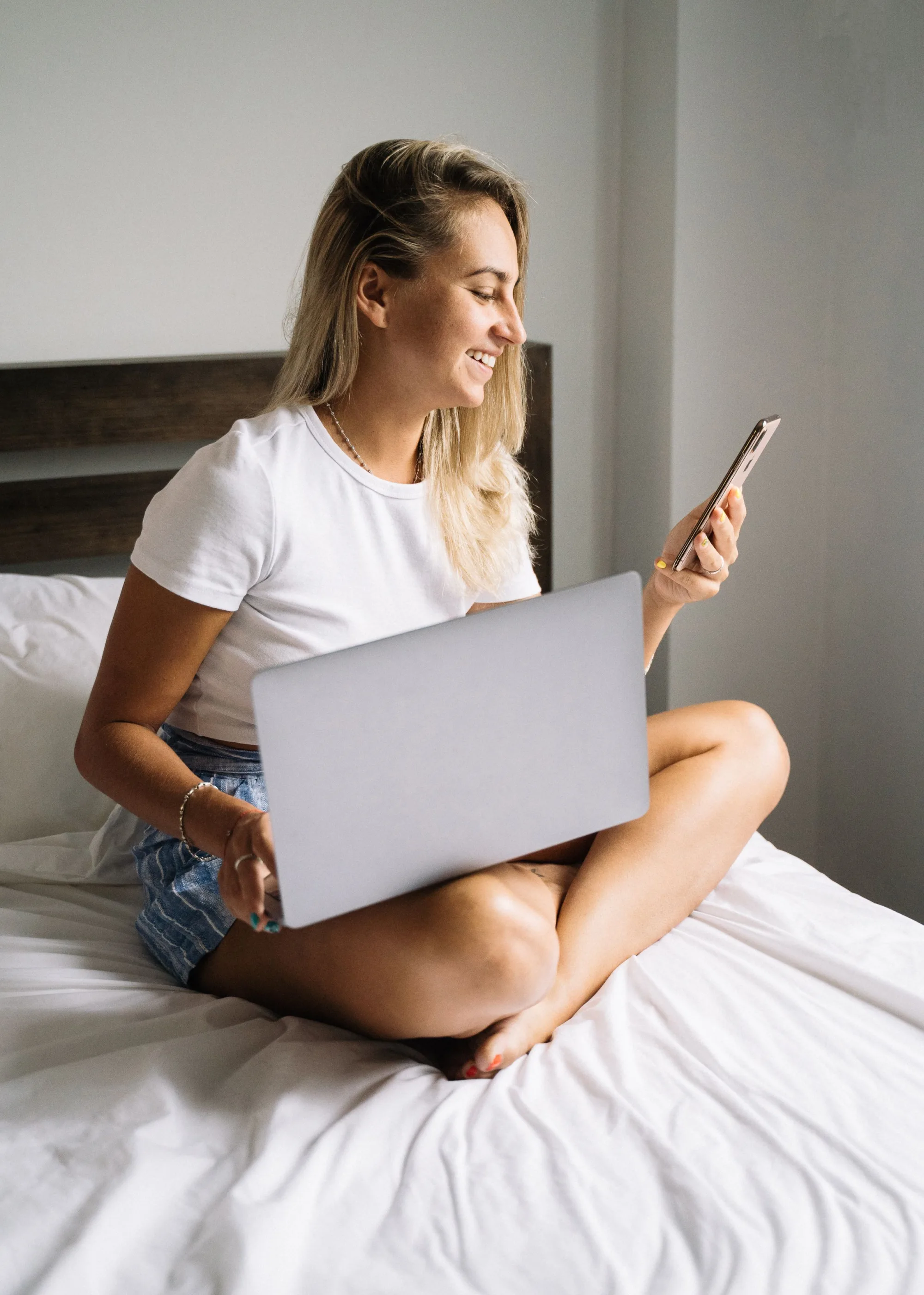 A client on her laptop in bed