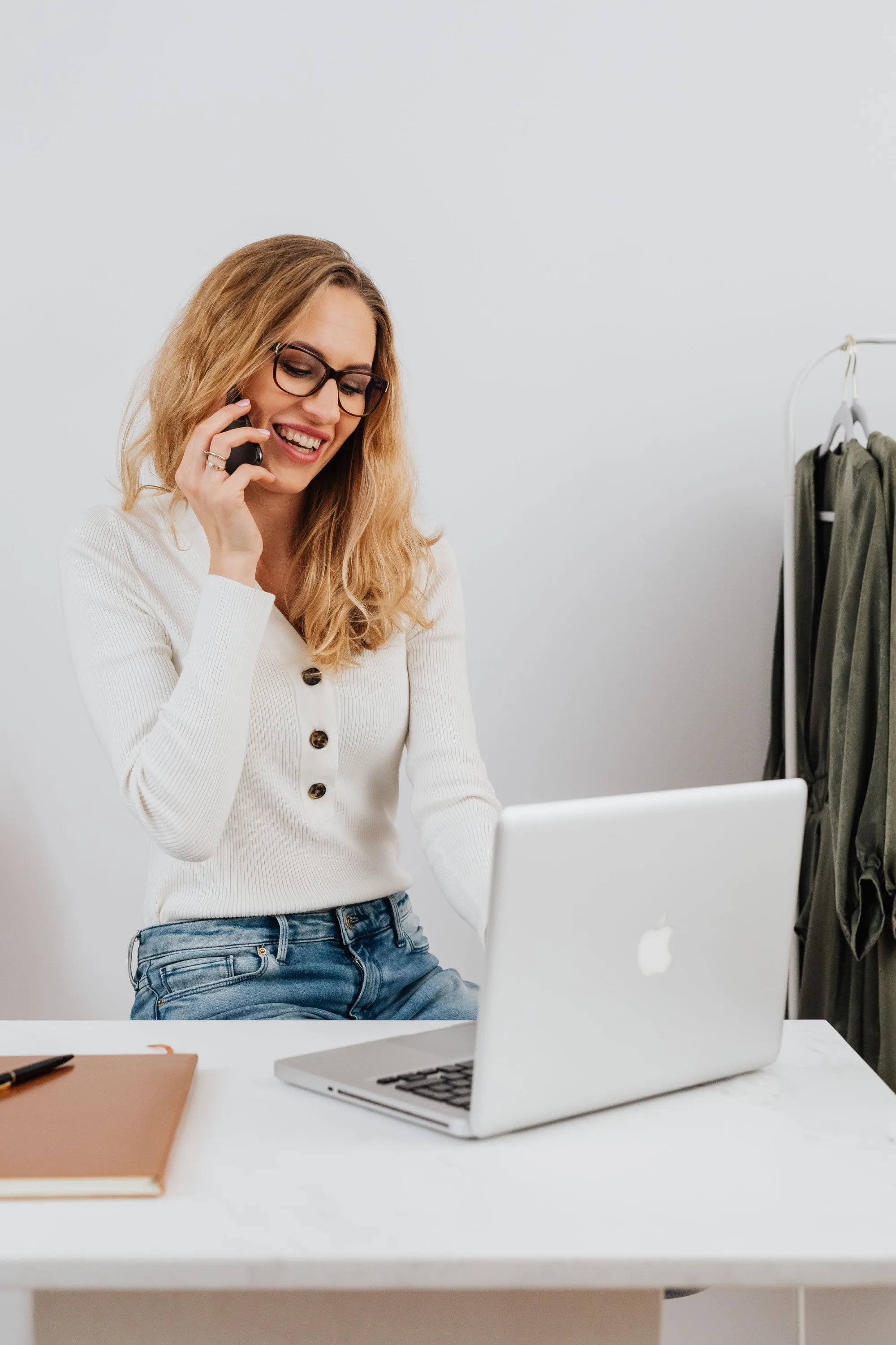 Blonde woman on the phone at her desk