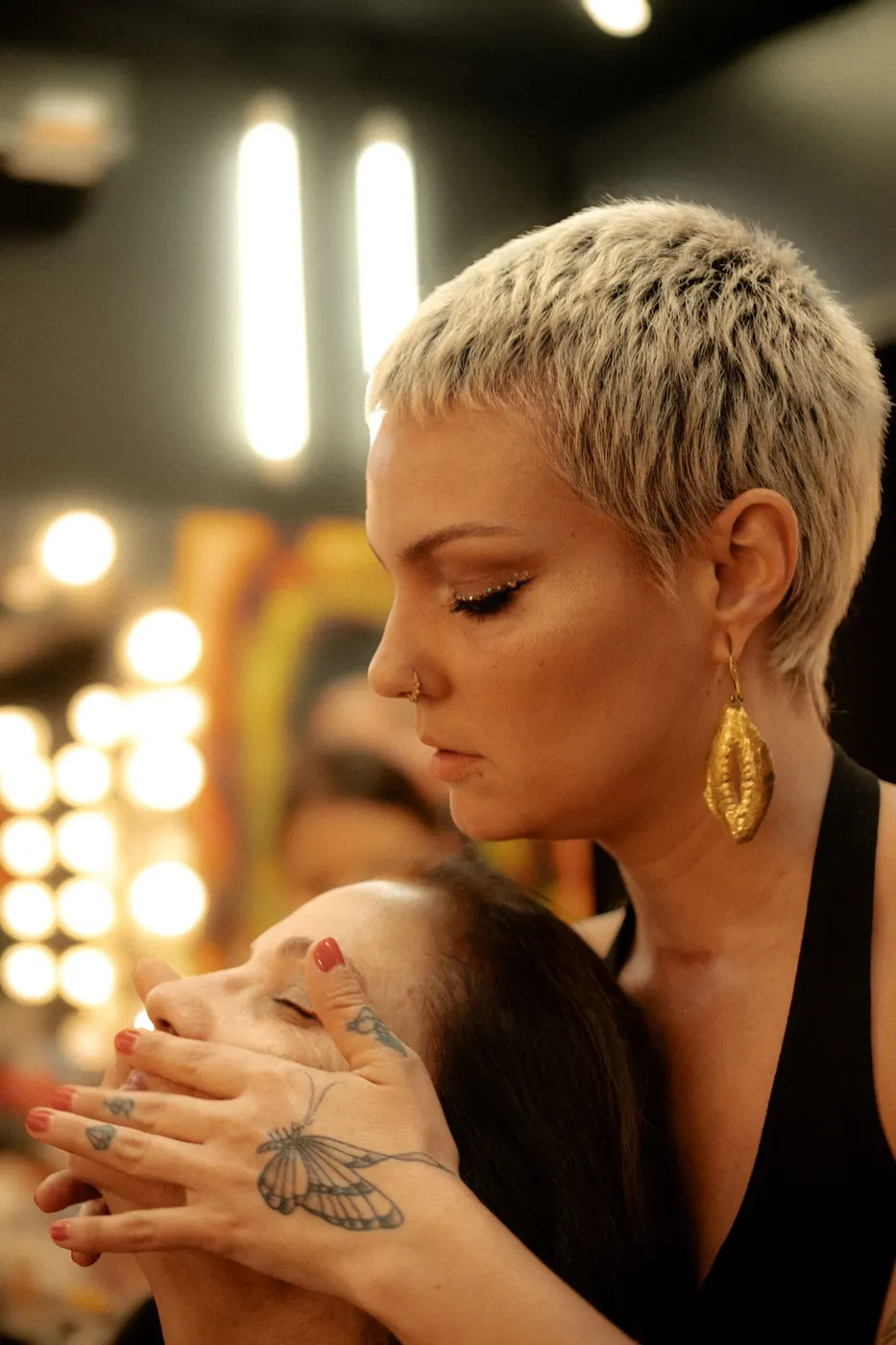A makeup artist working on a client